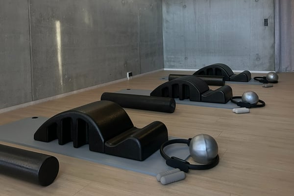 Spine correctors and props laid out on mats before class